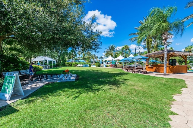 view of yard featuring a gazebo and a jacuzzi