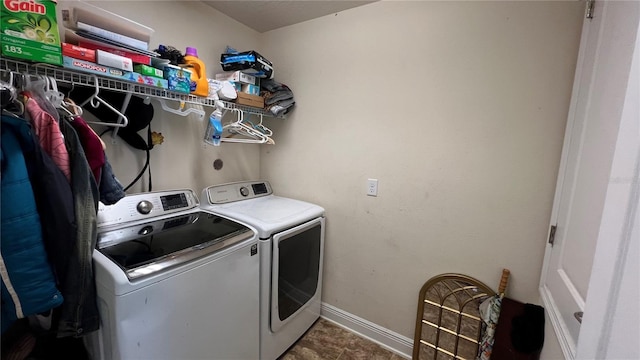 clothes washing area featuring washing machine and clothes dryer