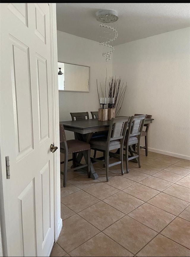 dining room featuring light tile patterned flooring