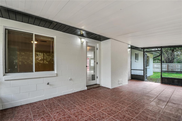 unfurnished room featuring expansive windows