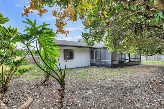 back of property featuring a sunroom