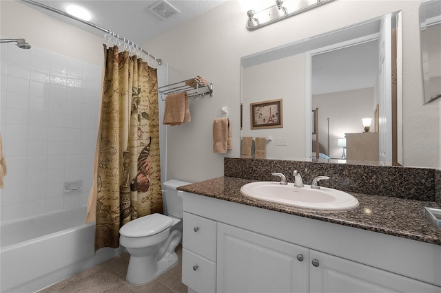 full bathroom featuring vanity, toilet, tile patterned flooring, and shower / bath combo with shower curtain