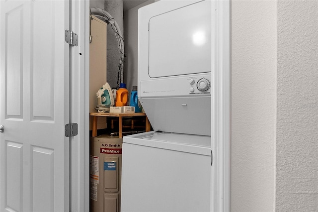 laundry room with stacked washer / drying machine