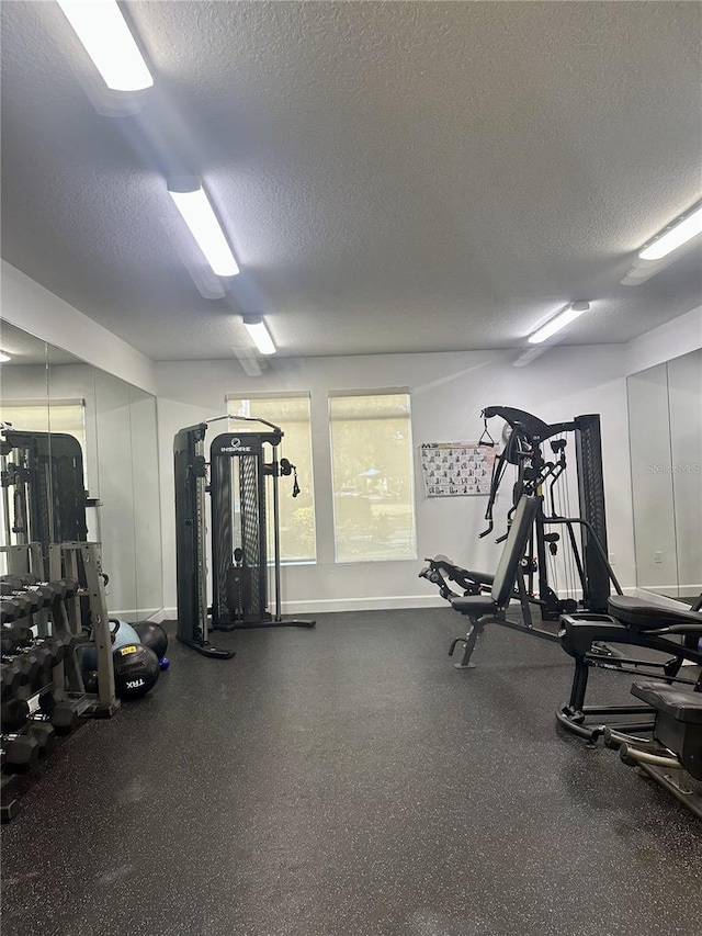 workout area with a textured ceiling