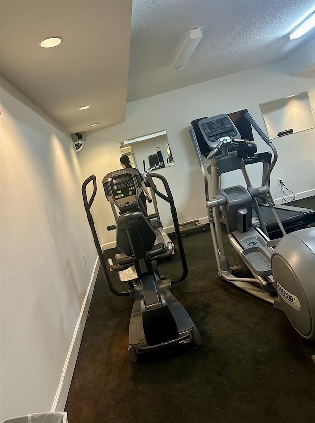 workout area with a textured ceiling