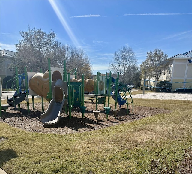 view of jungle gym with a lawn