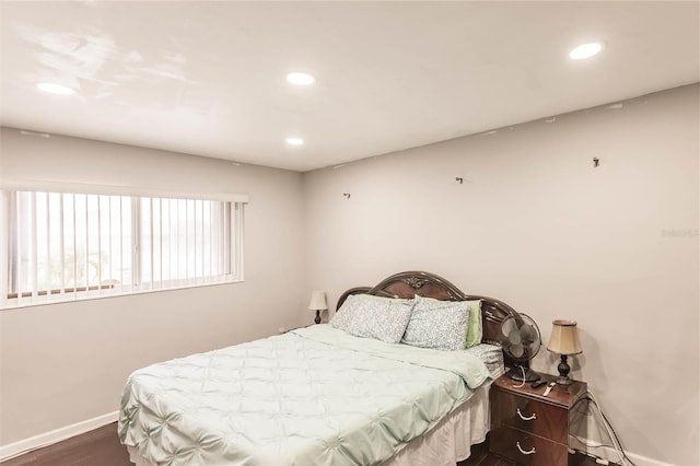 bedroom featuring dark wood-type flooring