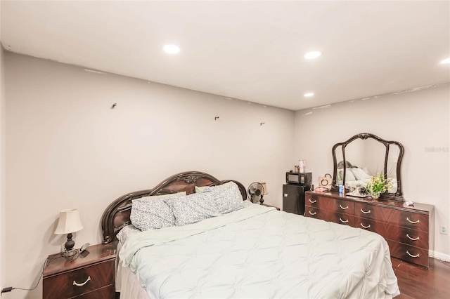 bedroom with hardwood / wood-style floors