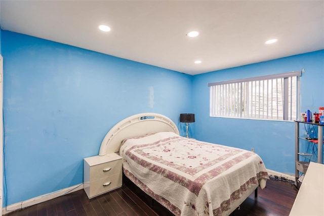 bedroom featuring dark hardwood / wood-style flooring