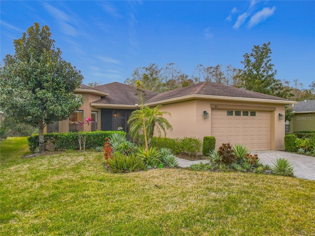 view of front of house featuring a garage and a front yard