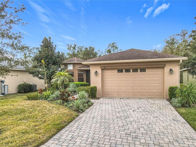 view of front facade with a garage and a front lawn