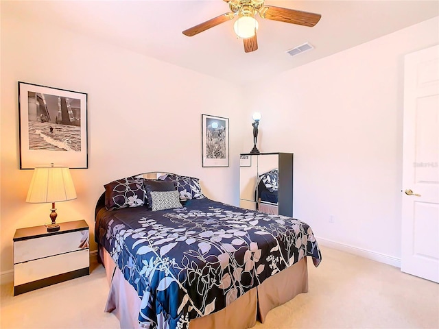 bedroom featuring ceiling fan and carpet