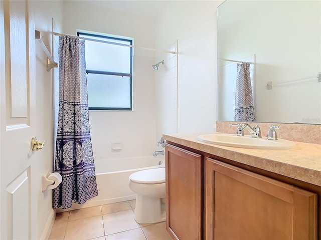 full bathroom featuring tile patterned flooring, vanity, toilet, and shower / bath combo with shower curtain