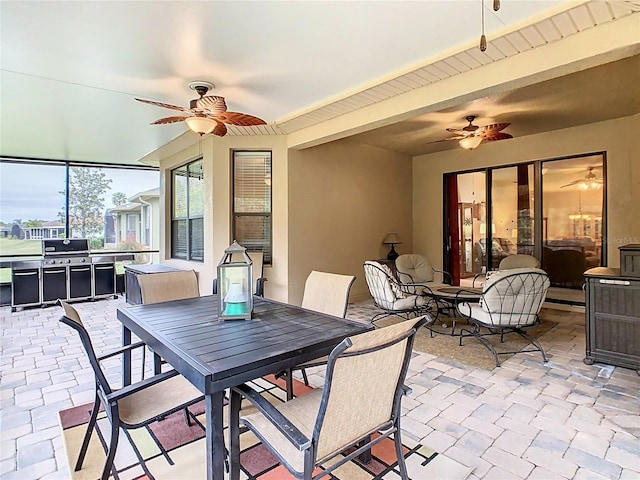 view of patio with a grill and ceiling fan