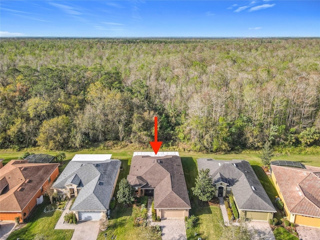 bird's eye view featuring a residential view and a forest view