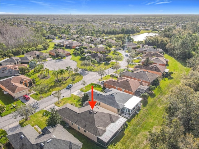 bird's eye view featuring a residential view and a water view