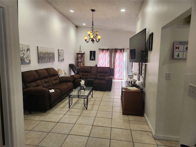 tiled living room with a notable chandelier and a textured ceiling