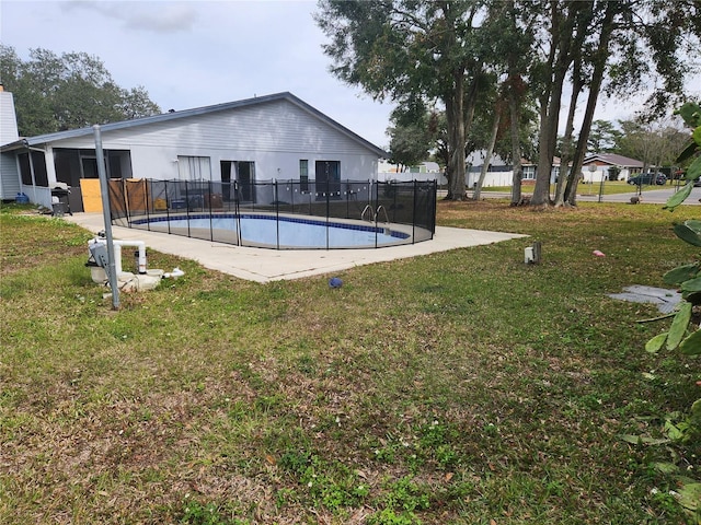 view of pool featuring a patio and a lawn