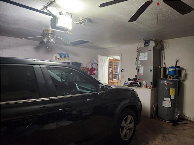 garage with water heater, a garage door opener, heating unit, and ceiling fan