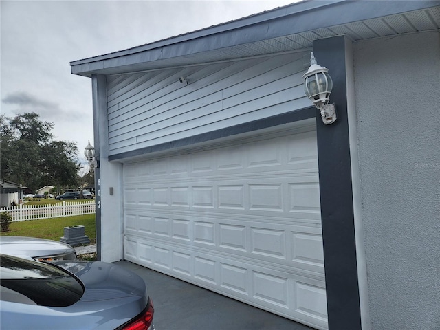 602 Caddy Dr, Kissimmee, FL 34759 - garage featuring cooling unit and fence