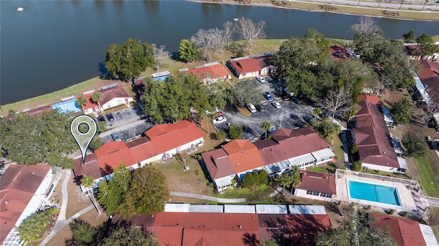 aerial view featuring a water view and a residential view