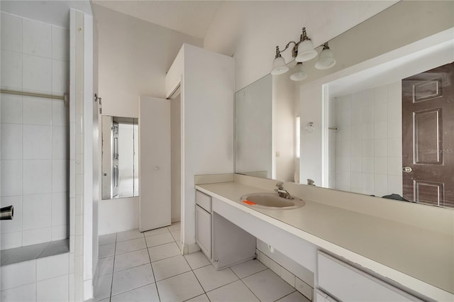 bathroom featuring tile patterned flooring and vanity