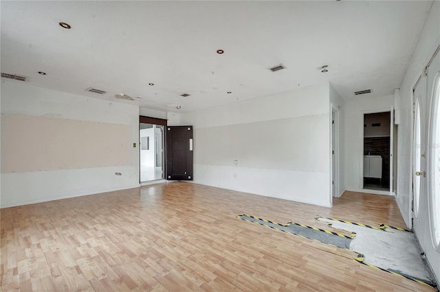 empty room with light hardwood / wood-style floors