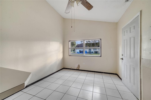 spare room featuring light tile patterned flooring and ceiling fan