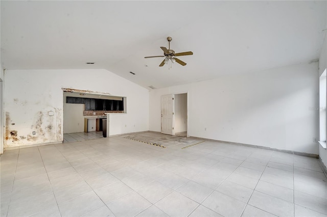 unfurnished living room with lofted ceiling, light tile patterned floors, and ceiling fan