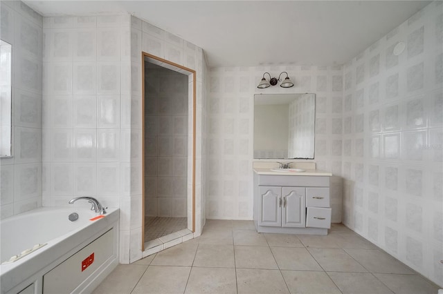 bathroom featuring tile patterned flooring, vanity, and independent shower and bath