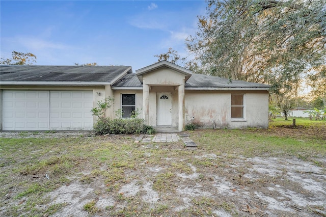 single story home featuring a garage