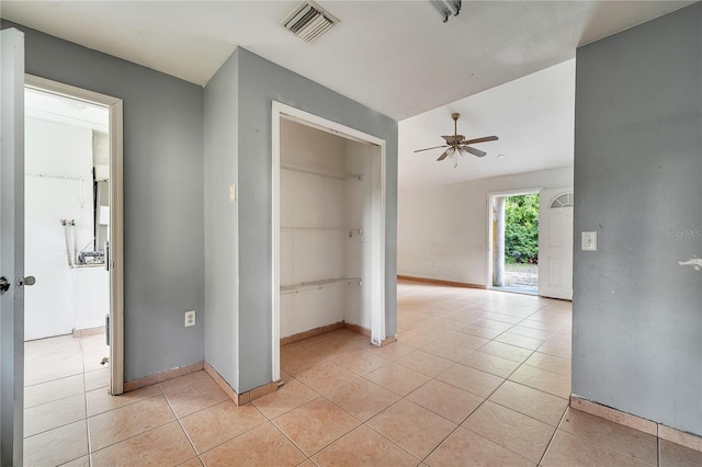 hallway with light tile patterned floors