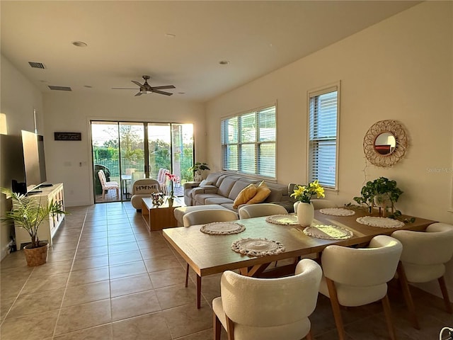 tiled dining room featuring ceiling fan