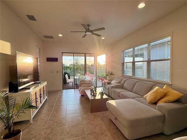 tiled living room featuring ceiling fan