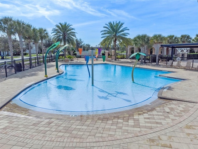 view of swimming pool with a patio area