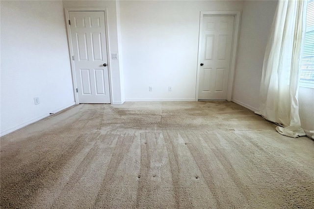 spare room with light carpet