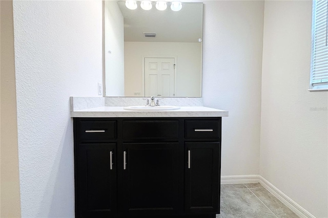 bathroom with vanity and tile patterned floors