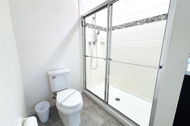 bathroom with walk in shower, tile patterned floors, and toilet