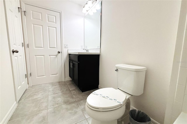 bathroom with vanity, tile patterned floors, and toilet