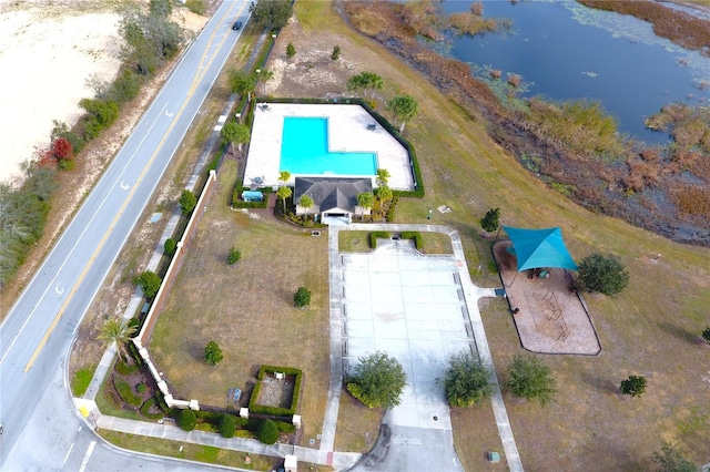 birds eye view of property with a water view