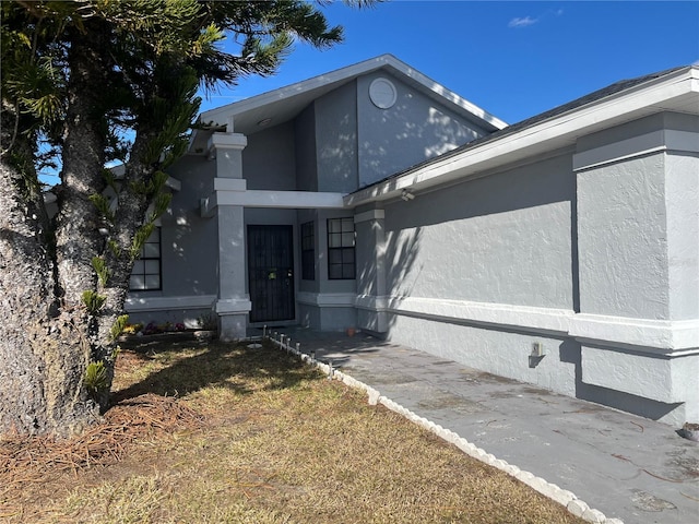 view of side of home featuring a lawn