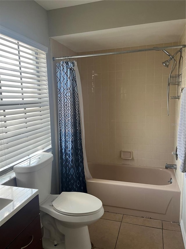 full bathroom with tile patterned floors, toilet, vanity, and shower / bath combo