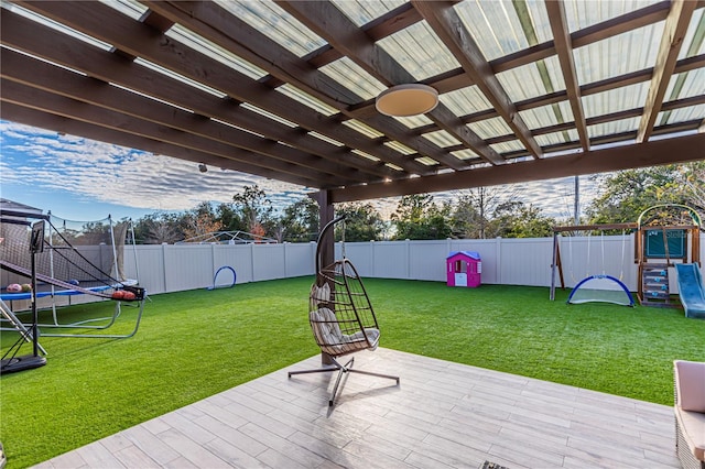 view of patio / terrace featuring a playground and a trampoline