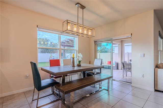 dining space with a healthy amount of sunlight and light tile patterned floors