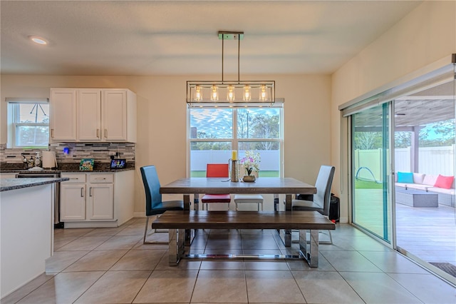 dining area featuring light tile patterned floors