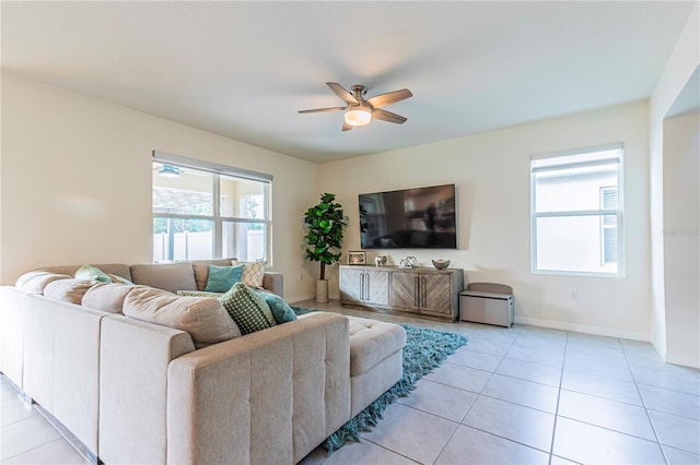 tiled living room featuring ceiling fan