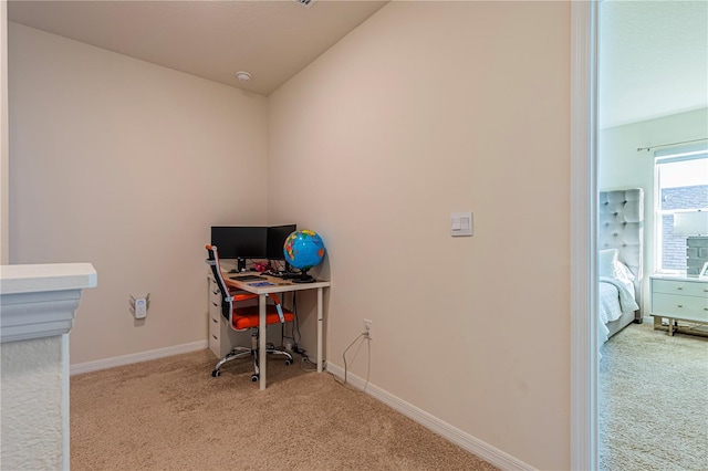 office area featuring light colored carpet