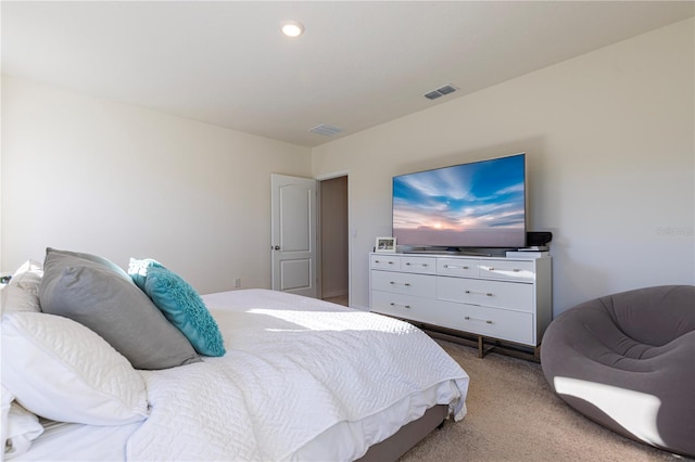 bedroom featuring light colored carpet