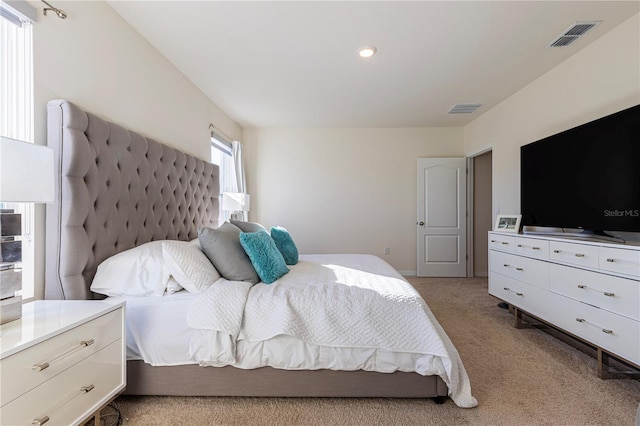 bedroom featuring light colored carpet