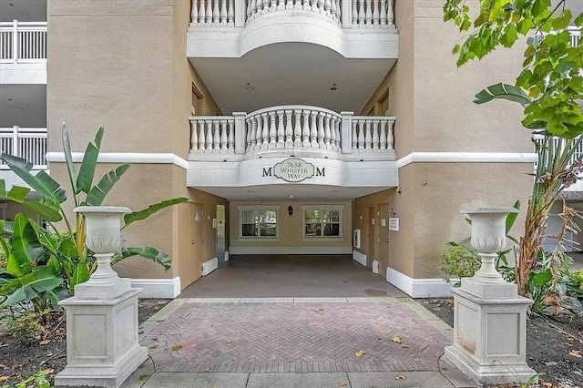 doorway to property featuring a balcony